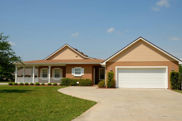 Roof Repair, image of a suburban home in summer time